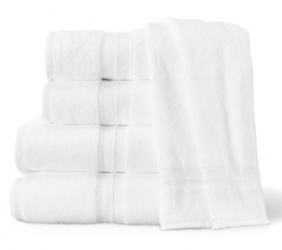 Stack of four white hotel towels